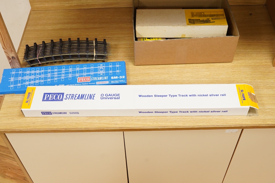 Four boxed Bassett-Lowke by Corgi 0 gauge railway freight wagons; a BR 20-ton brake van, together with two Southern Railways open wagons and a ventilated box van, together with a boxed Tenmille Products kit for a Talylly